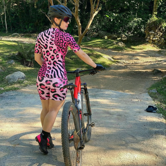 Woman Wearing Neon Safari Maximalist Animal Print Pro Aero Jersey Built for Road Cycling and Long Training Rides