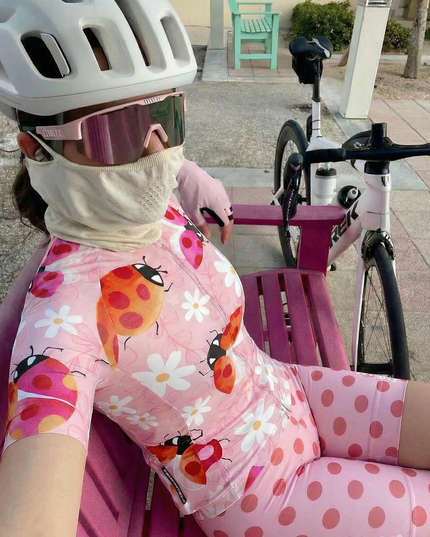Woman Wearing Ladybug Meadow Spring Botanical Pro Aero Jersey Tailored with Stretch Fit for Race-Inspired Silhouette
