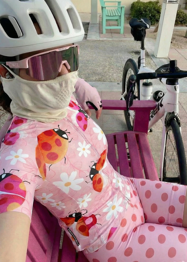 Woman Wearing Ladybug Meadow Spring Botanical Pro Aero Jersey Tailored with Stretch Fit for Race-Inspired Silhouette