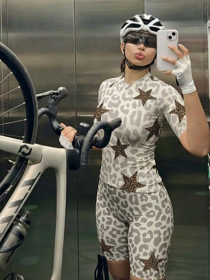 Woman Wearing Stellar Mirage All-Weather Double-Leopard Pro Aero Jersey Crafted from Moisture-Wicking Fabric to Stay Dry on the Ride