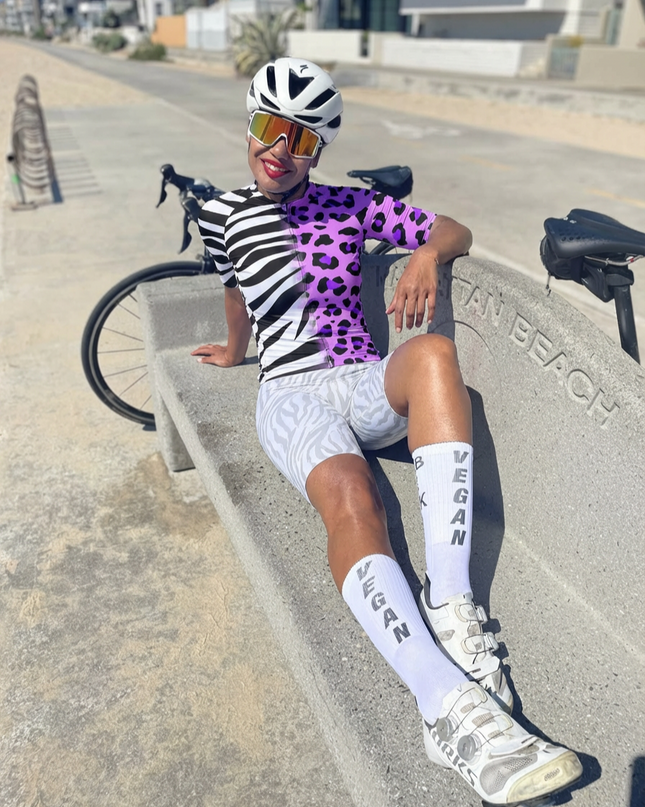 Woman Wearing Zebra-Leopard Hybrid All-Weather Pro Aero Jersey Crafted from Moisture-Wicking Fabric to Stay Dry on the Ride