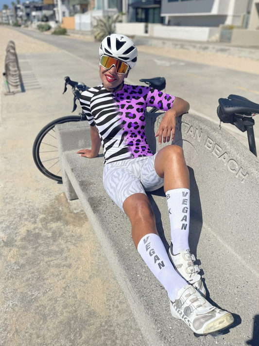 Woman Wearing Zebra-Leopard Hybrid All-Weather Pro Aero Jersey Crafted from Moisture-Wicking Fabric to Stay Dry on the Ride